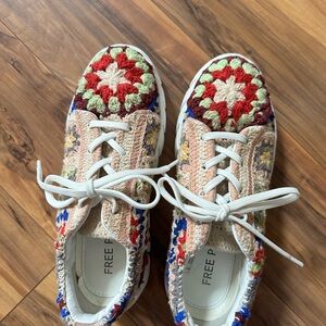 Free People sneakers. Beautiful flowered crochet  leather interior.
